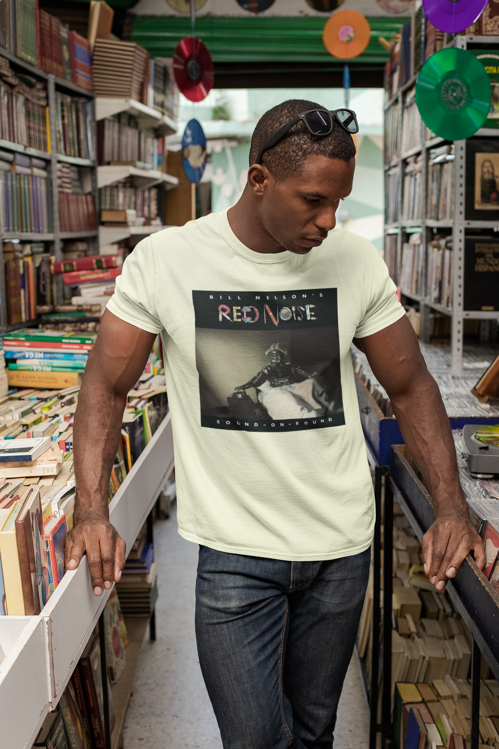 Bill Nelson's Red Noise Sound on Sound T-shirt  - Following the release of the album ‘Drastic Plastic’ ,Bill Nelson disbanded Be Bop Deluxe. Aware of the emergence of the so-called New Wave artists and out of a desire to continually evolve and progress as a musician, he announced the formation of a new band, Red Noise. 
Working with co-producer John Leckie, Bill recorded a new wave masterpiece, a record that would influence a new generation of musicians with its intelligent and punchy material.