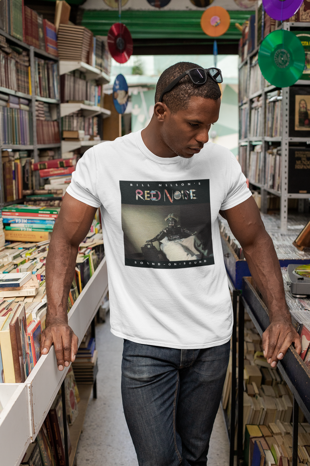 Bill Nelson's Red Noise Sound on Sound T-shirt  - Following the release of the album ‘Drastic Plastic’ ,Bill Nelson disbanded Be Bop Deluxe. Aware of the emergence of the so-called New Wave artists and out of a desire to continually evolve and progress as a musician, he announced the formation of a new band, Red Noise. 
Working with co-producer John Leckie, Bill recorded a new wave masterpiece, a record that would influence a new generation of musicians with its intelligent and punchy material.