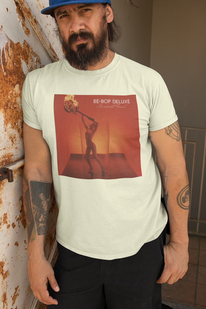 Be-Bop Deluxe Bill Nelson Sunburst Finish T-shirt - An album of immense musical inventiveness and creativity, ‘Sunburst Finish’ was one of the finest albums of its era, a perfect cohesion of ten classic songs written by Nelson. Including such classic tracks as ‘Heavenly Homes’, ‘Crying To The Sky’, ‘Sleep That Burns’, ‘Life In The Air Age’, and ‘Blazing Apostles’, the album also spawned the hit single ‘Ships In The Night’ and launched Be-Bop Deluxe as one of the major breakthrough acts of 1976.