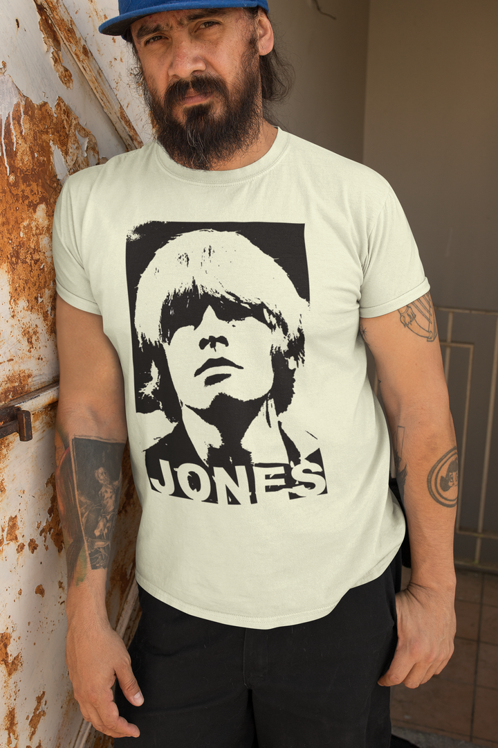 Brian Jones of The Rolling Stones Retro Negative Effect T-Shirt – Brian Jone’s attitude and stage presence did a good deal to help define the Rolling Stones' image in the 1960s, and his skills on a variety of instruments lent many of their records a diversity and eclecticism that the group would never match after his departure. Jones was already a rebel who embodied the more flamboyant aspects of the Rolling Stones' lifestyle even before the Rolling Stones formed. A true one off!