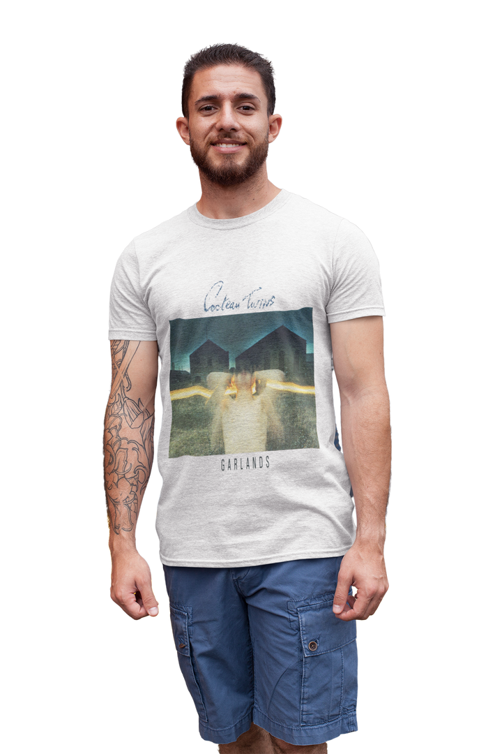 Cocteau Twins - Garlands T-Shirt 
Cocteau Twins were a Scottish post-punk/ethereal/dream pop band formed in 1981 in Grangemouth, Falkirk. Known for their unique sound and ethereal vocals, the band captivated audiences with their dreamlike melodies and atmospheric music. With a career spanning over 15 years, Cocteau Twins left an indelible mark on the music industry before disbanding in 1997. Their innovative approach to music continues to inspire artists today.