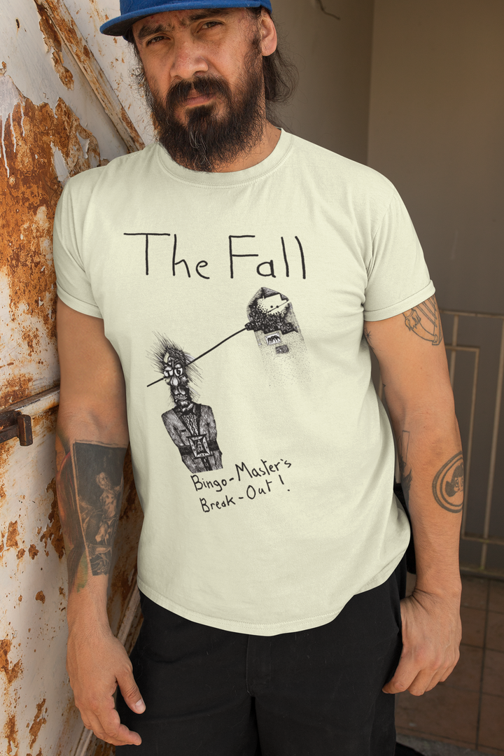 Honour the Post-Punk Pioneers! Immerse yourself in the world of Mark E Smith & The Fall with this t-shirt that pays tribute to the iconic post-punk band. From enigmatic album artwork to the unmistakable "The Fall" logo, capture the essence of their distinctive music and unconventional performances. Show your love for The Fall and let the spirit of the band elevate your style with unmatched post-punk brilliance!