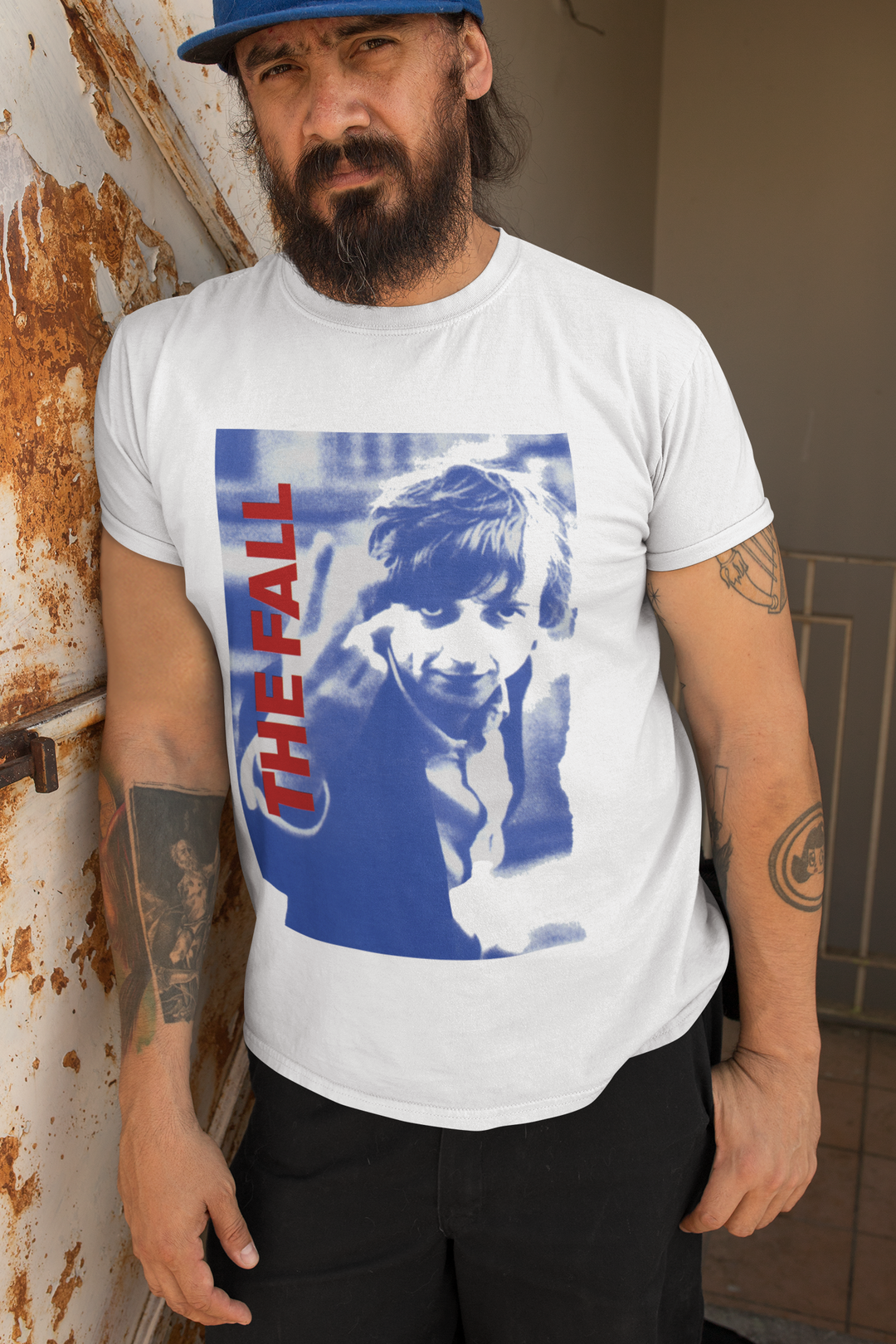 Honour the Post-Punk Pioneers! Immerse yourself in the world of Mark E Smith & The Fall with this t-shirt that pays tribute to the iconic post-punk band. From enigmatic album artwork to the unmistakable "The Fall" logo, capture the essence of their distinctive music and unconventional performances. Show your love for The Fall and let the spirit of the band elevate your style with unmatched post-punk brilliance!