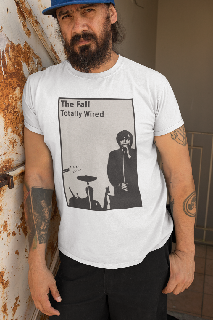 Honour the Post-Punk Pioneers! Immerse yourself in the world of Mark E Smith & The Fall with this t-shirt that pays tribute to the iconic post-punk band. From enigmatic album artwork to the unmistakable "The Fall" logo, capture the essence of their distinctive music and unconventional performances. Show your love for The Fall and let the spirit of the band elevate your style with unmatched post-punk brilliance!