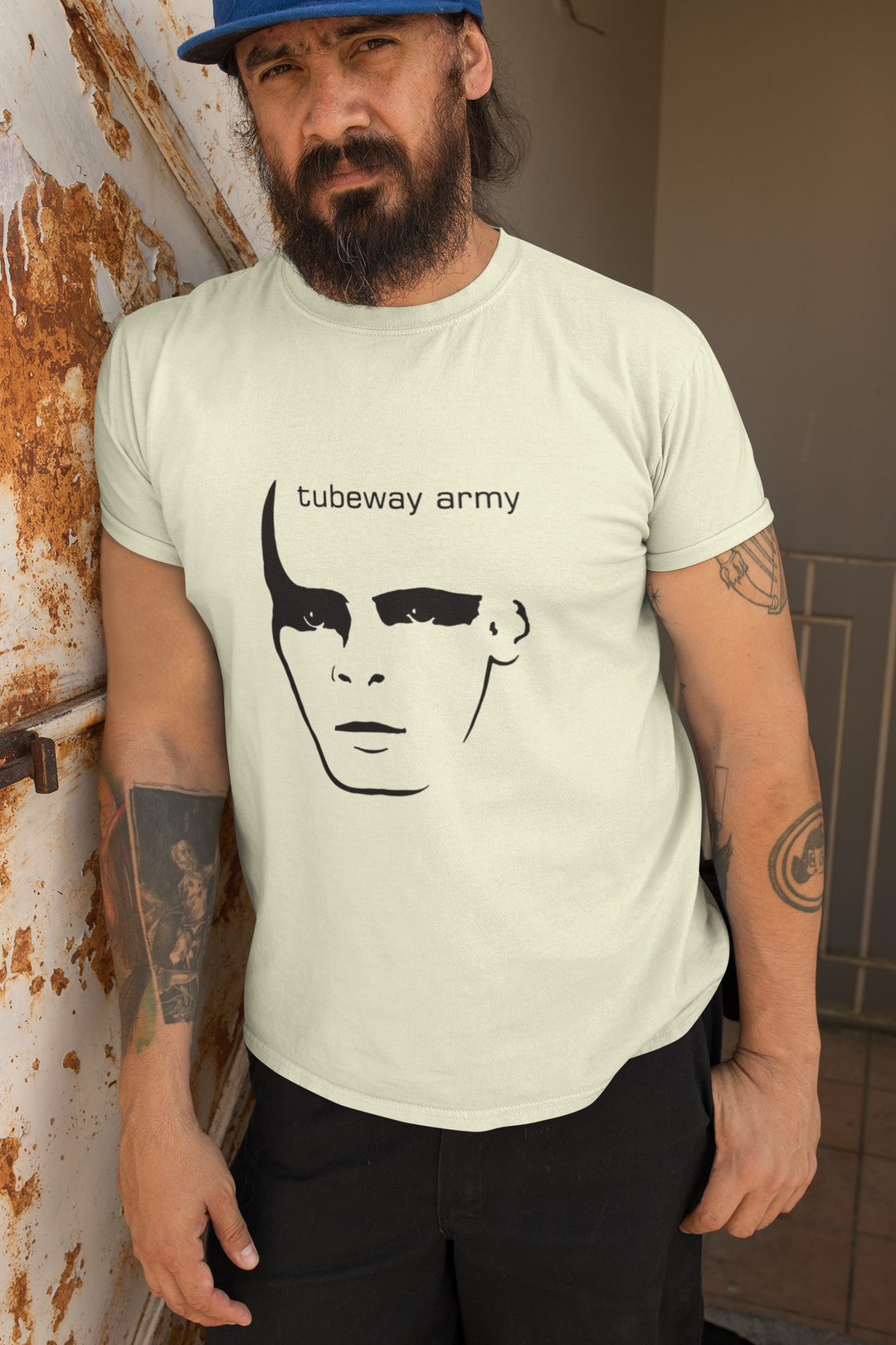 Gary Numan Tubeway Army Tribute T-shirt
Gary Numan is a renowned artist who began his musical journey as a punk rocker in the band Mean Street but eventually formed his own punk band called Tubeway Army. Gary Numan soon
stumbled upon a "Minimoog" synthesizer left behind in the studio, which captivated him with its unique sound. His early experiences as a punk rocker laid the foundation for his innovative approach to electronic music and paved the way for his future success as an artist.