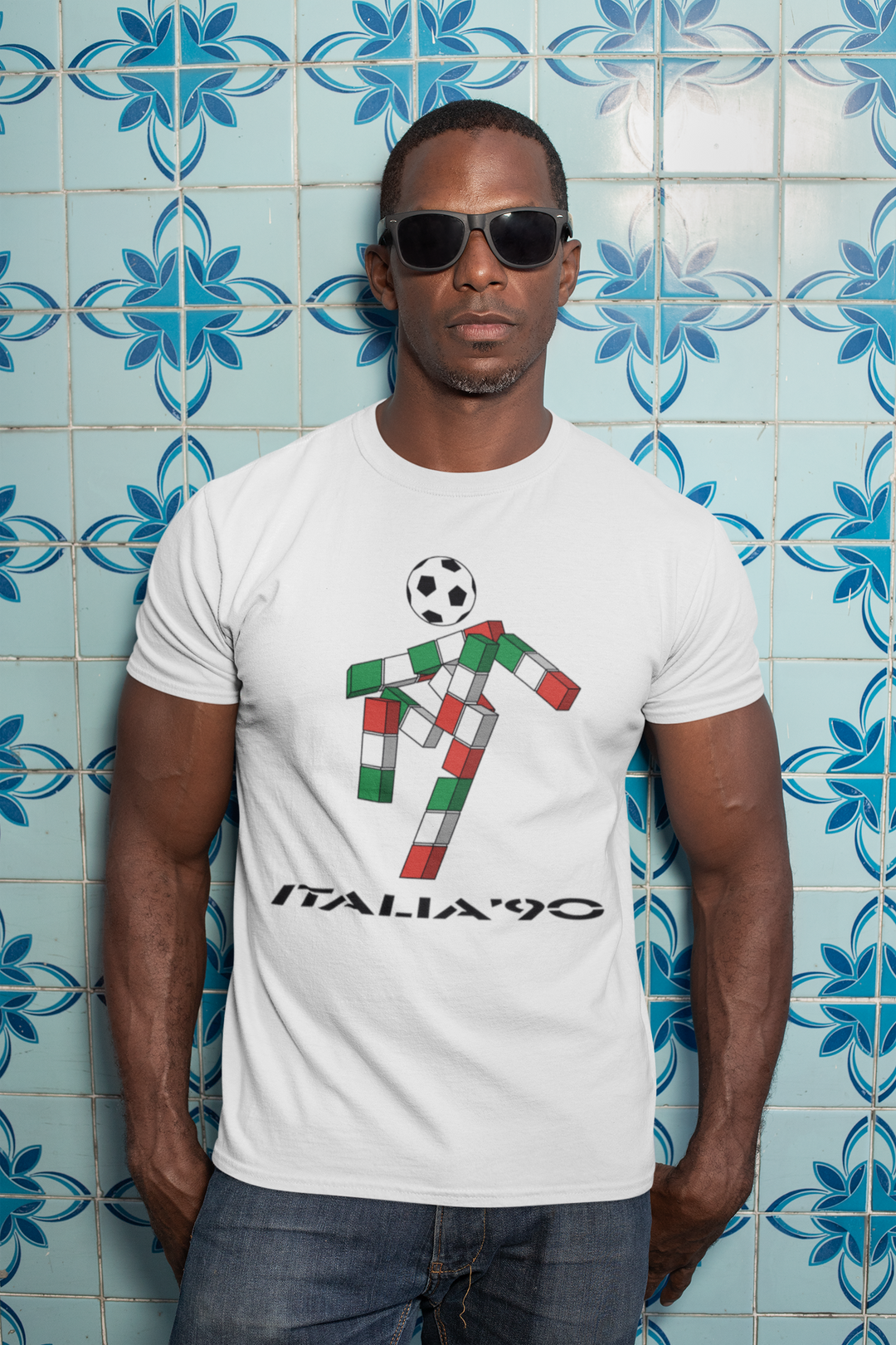 We love a retro t-shirt here and our ultra cool Italia 90 t-shirt is no exception. Ciao was the mascot for the 1990 FIFA World Cup in Italy: 
A gender-neutral, futuristic stick figure with a football head and an Italian tricolor body that spelled out "ITALIA" 
Designed by Lucio Boscardin, a self-taught graphic designer.