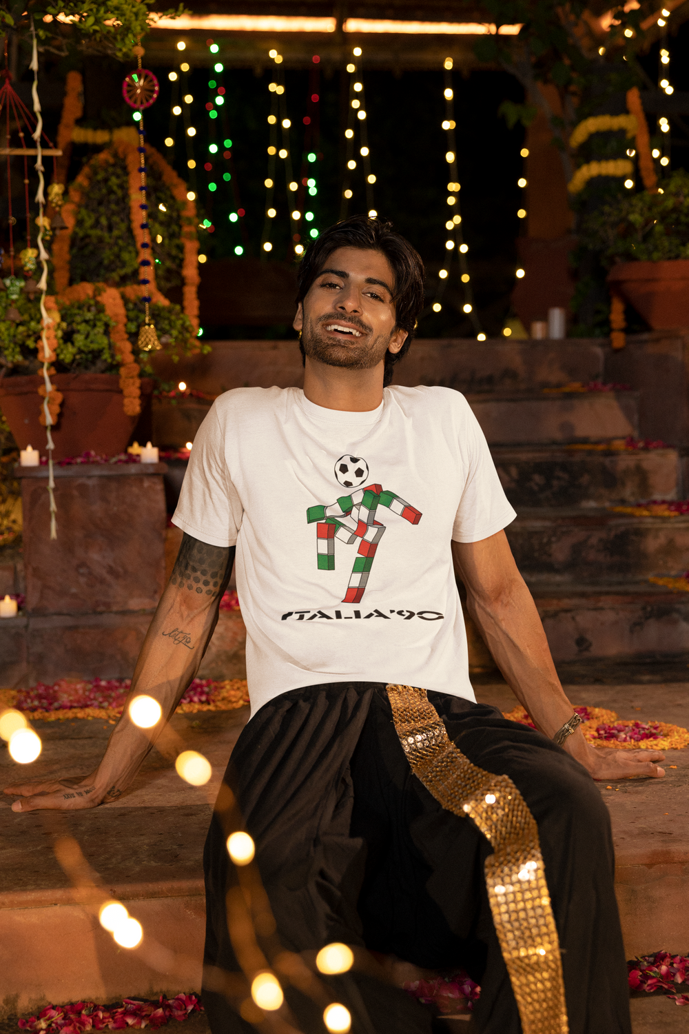 We love a retro t-shirt here and our ultra cool Italia 90 t-shirt is no exception. Ciao was the mascot for the 1990 FIFA World Cup in Italy: 
A gender-neutral, futuristic stick figure with a football head and an Italian tricolor body that spelled out "ITALIA" 
Designed by Lucio Boscardin, a self-taught graphic designer.