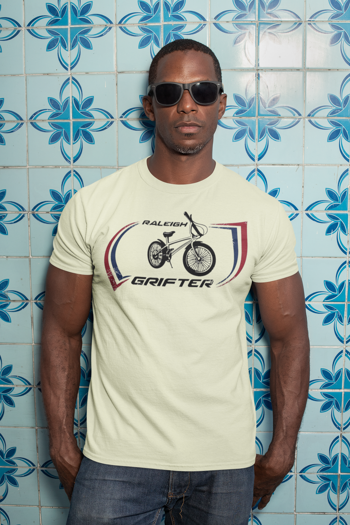 The Raleigh Grifter As worn by Marc Bolan of T. REX T-shirt
Get a piece of 70's vintage with this Raleigh Grifter t-shirt as worn by cool glam rock star Marc Bolan. The Raleigh Grifter was along with the Raleigh Chopper one of the iconic bikes of the 1970's.