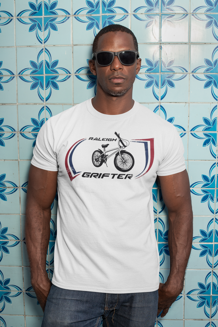 The Raleigh Grifter As worn by Marc Bolan of T. REX T-shirt
Get a piece of 70's vintage with this Raleigh Grifter t-shirt as worn by cool glam rock star Marc Bolan. The Raleigh Grifter was along with the Raleigh Chopper one of the iconic bikes of the 1970's.