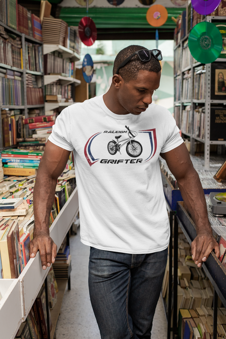The Raleigh Grifter As worn by Marc Bolan of T. REX T-shirt
Get a piece of 70's vintage with this Raleigh Grifter t-shirt as worn by cool glam rock star Marc Bolan. The Raleigh Grifter was along with the Raleigh Chopper one of the iconic bikes of the 1970's.