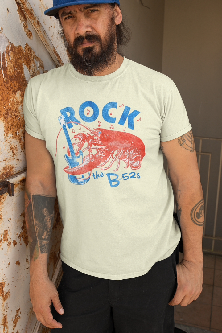 **IMPORTED FROM THE U.S.A - We have very limited stock of this t-shirt, and once it is sold out we are unable to get new stock as it has been discontinued**
Known for their unique sound and energetic performances, The B-52's have been incredibly influential to a whole host of bands. Their style is instantly recognizable. With hits like "Love Shack" and "Rock Lobster," they have gained a dedicated fan base worldwide. Their catchy melodies and quirky lyrics make them a standout act in the New Wave genre. 
