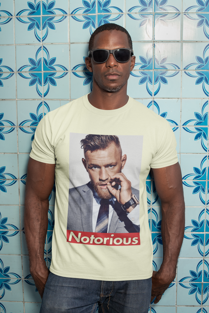 Show your support for Conor McGregor with this UFC T-shirt featuring The Notorious graphic. Perfect for fans of the UFC, this T-shirt is a must-have for any collection.