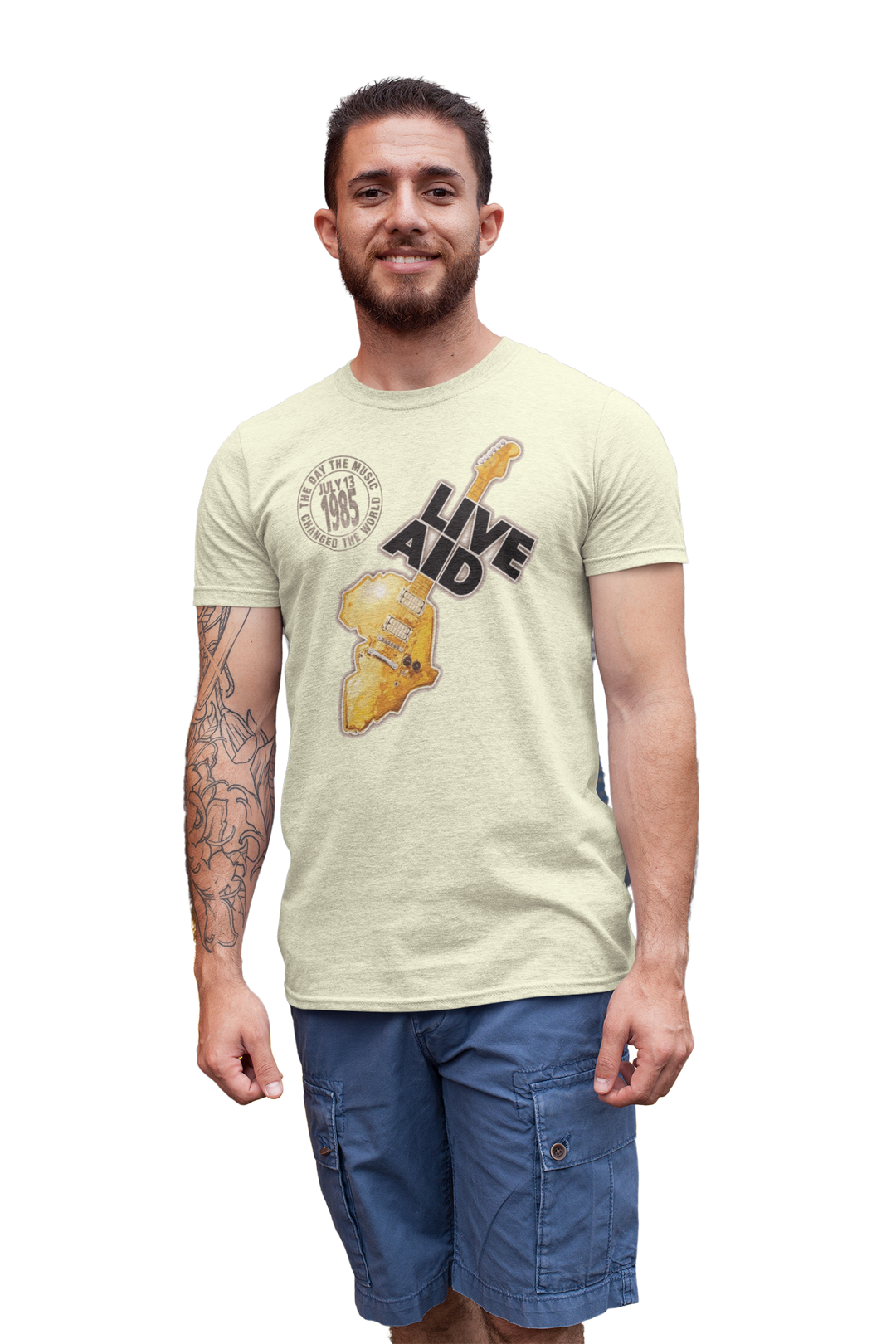 Live Aid was a benefit concert held at Wembly Stadium in London on July 13, 1985. The event grew from the Band Aid single "Do They Know It's Christmas?". That song featured many of the UK's top pop stars and was organized by Bob Geldof of Boomtown Rats and Midge Ure, then of Ultravox. Geldof wore a "Feed The World" T-shirt during the songs recording. All artists took the stage to further raise money for famine relief in Africa. *A portion of proceeds from this t-shirt sale benefits Oxfam.
